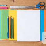 Chart paper decoration supplies flat lay with colored paper, pens and scissors