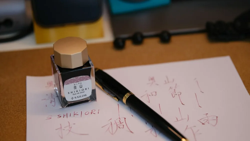 How to fill ink in a fountain pen from a bottle, with pen and ink on paper